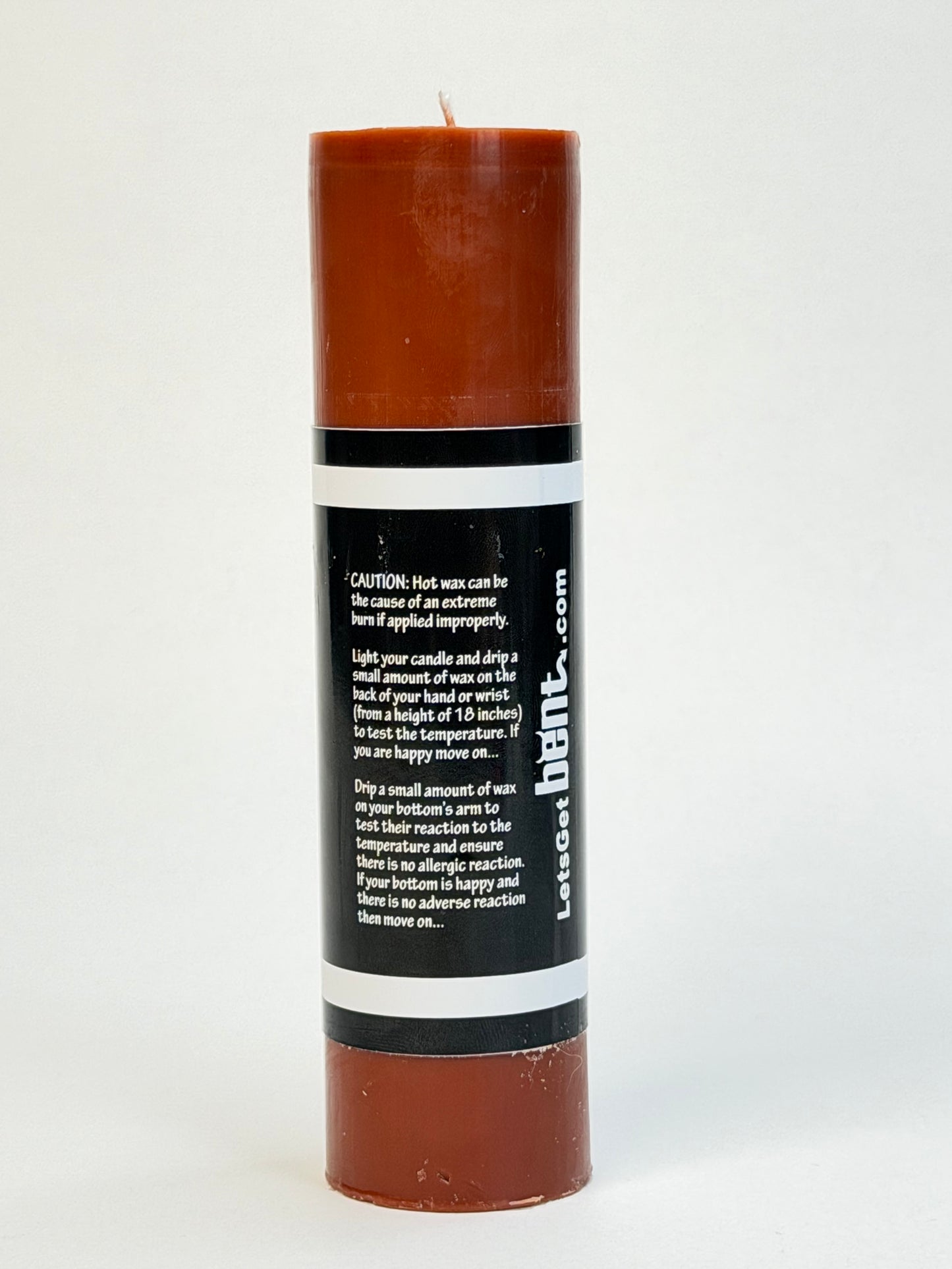 Brown low-temperature candle for wax play and sensory BDSM scenes