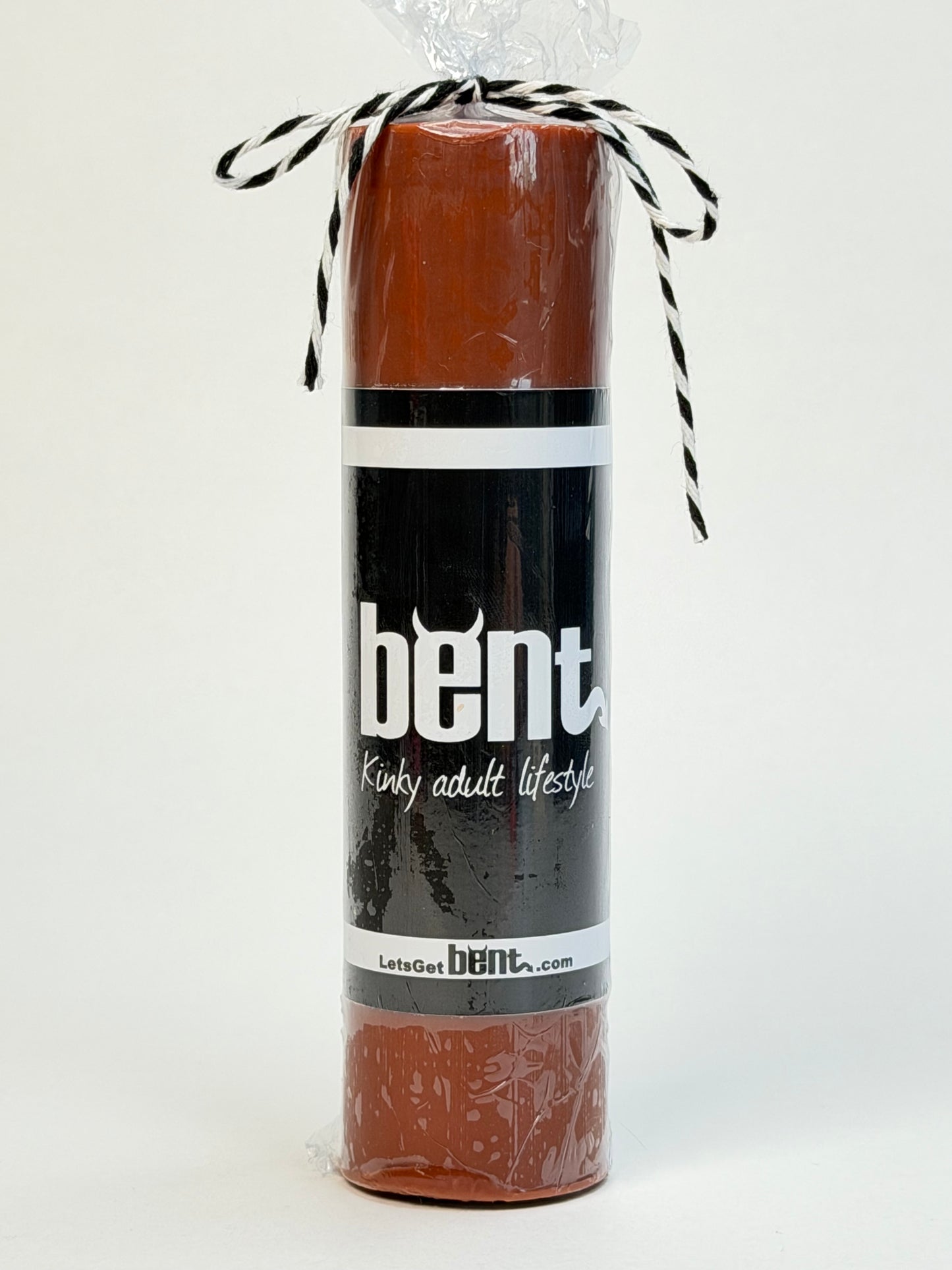 Bent Brown wax play candle with product packaging