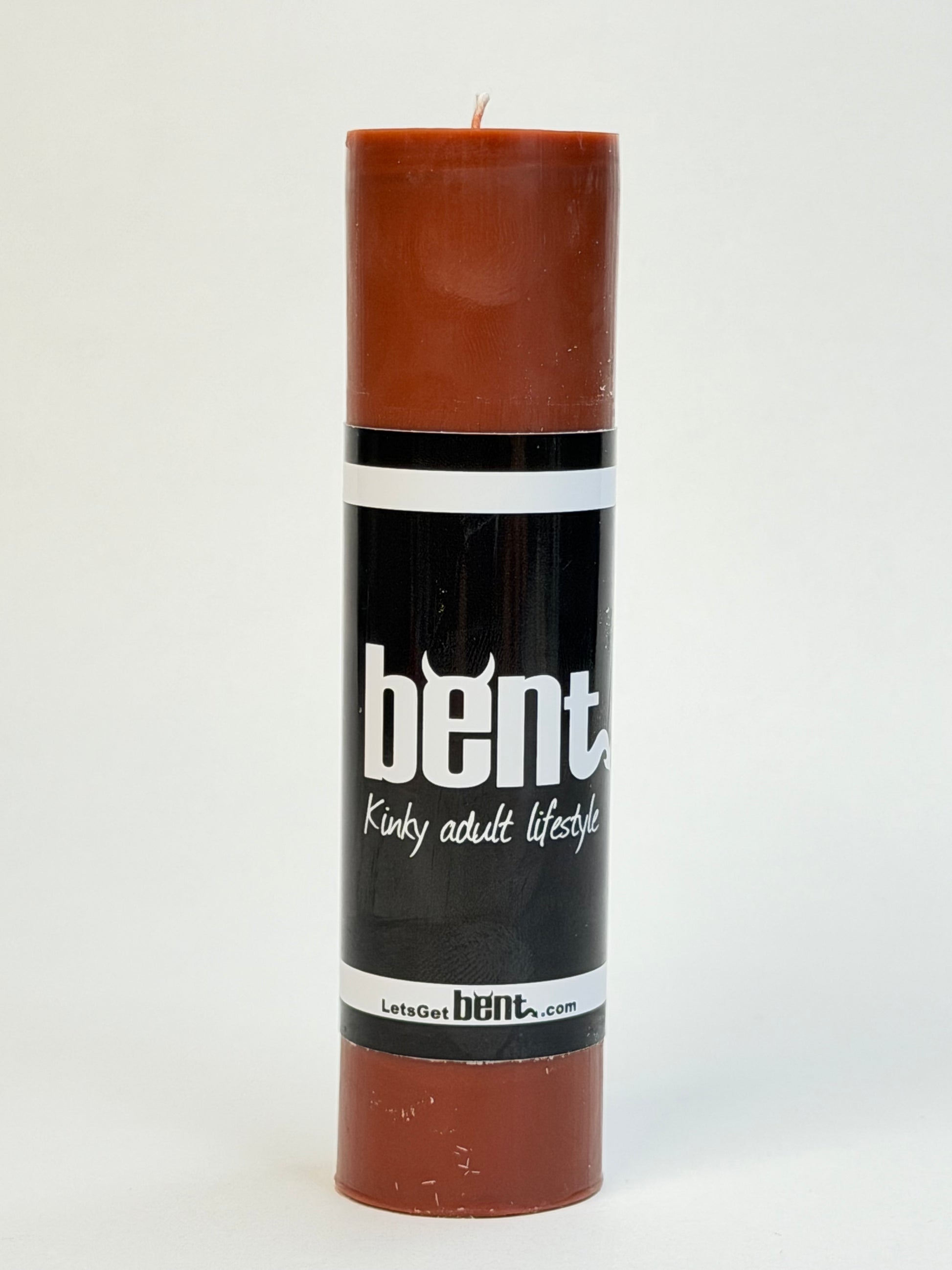 Bent brown low-temperature wax play pillar candle