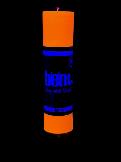 UV Orange candle under blacklight glowing