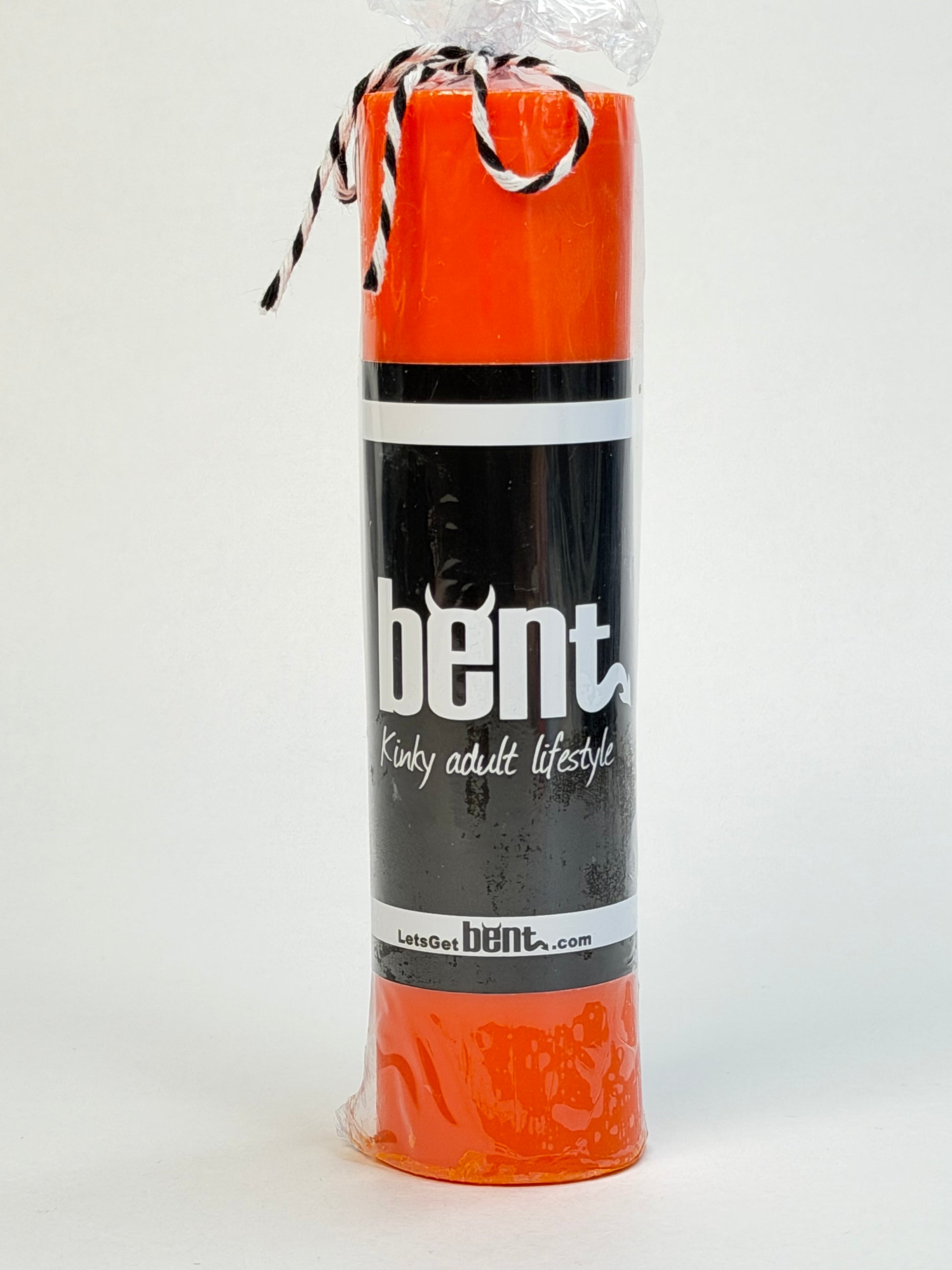 Handmade orange paraffin wax play pillar candle by Bent