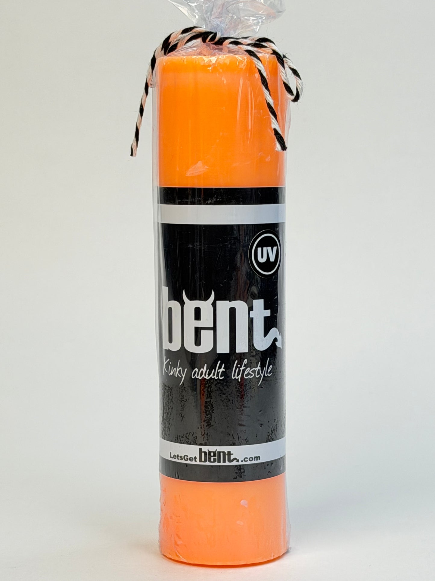 Handmade UV orange paraffin wax play pillar candle by Bent