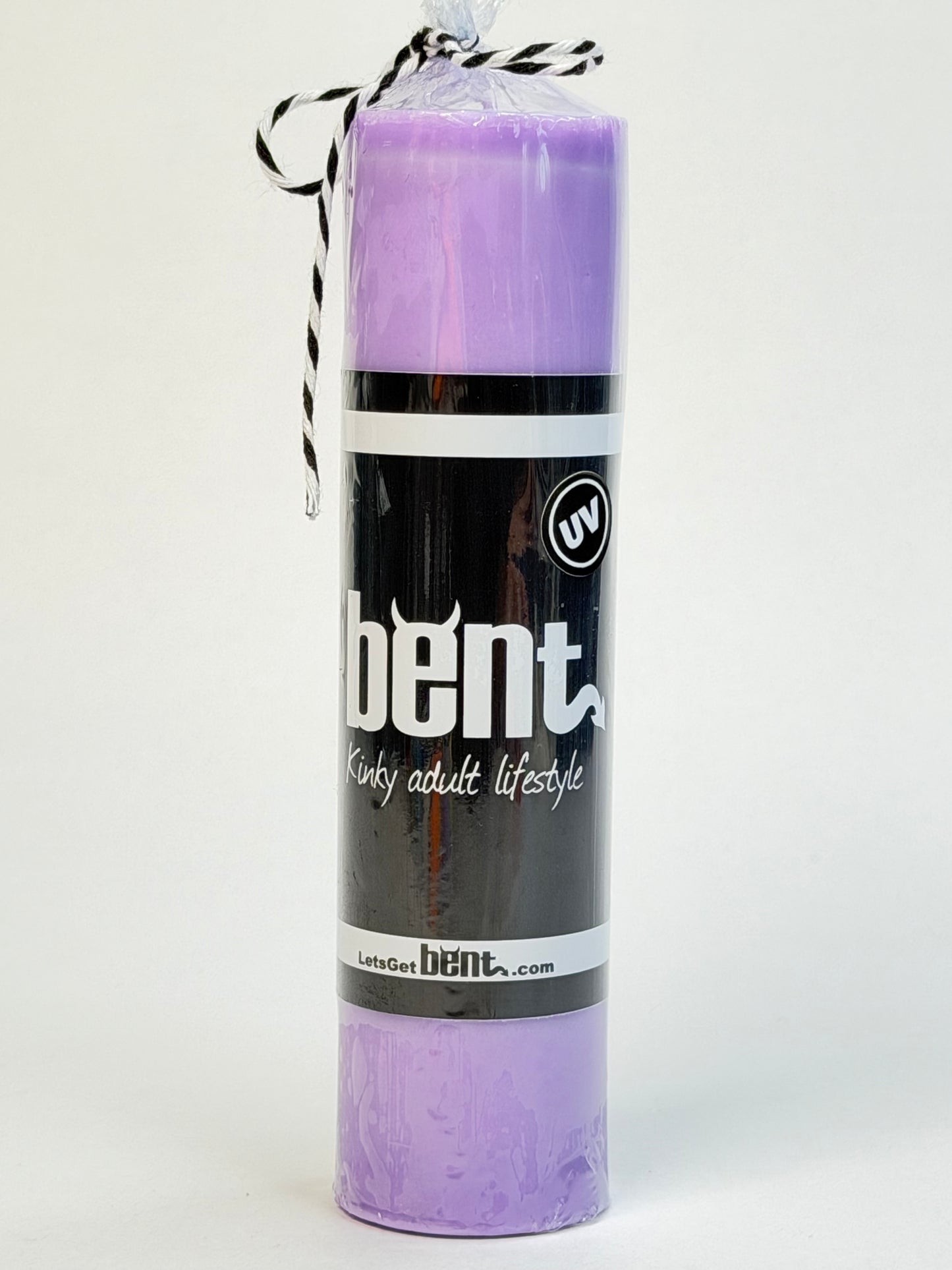Handmade UV purple paraffin wax play pillar candle by Bent in packaging