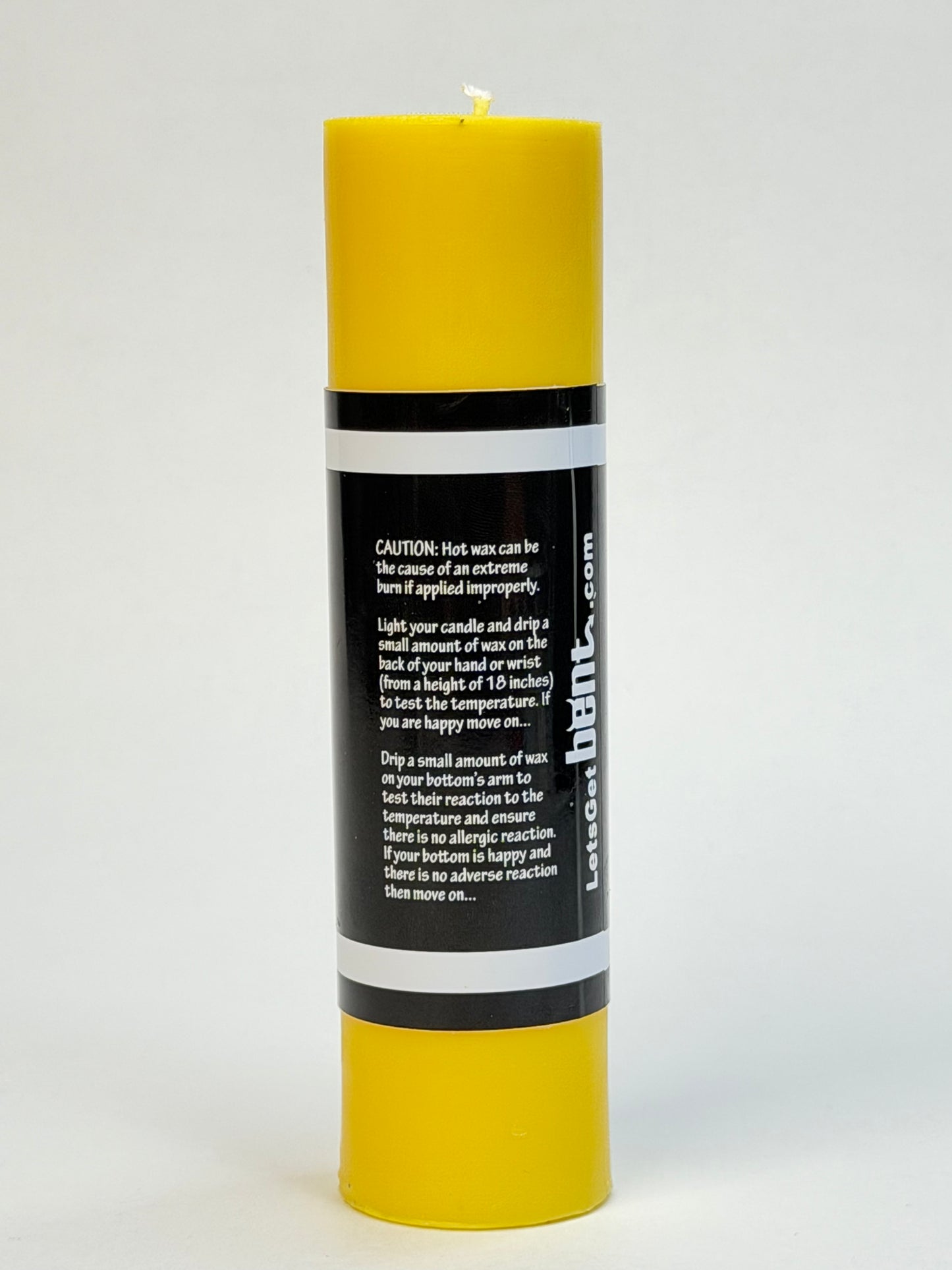 Back of Yellow Bent wax play candle 
